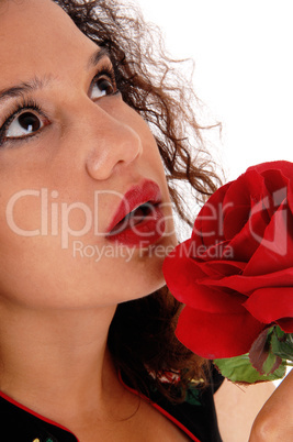 Face of woman with red rose.