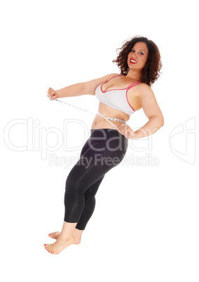 Exercise woman measuring stomach.