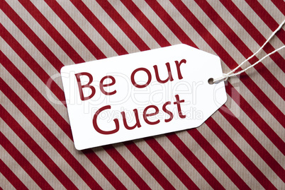 Label On Red Wrapping Paper, Text Be Our Guest