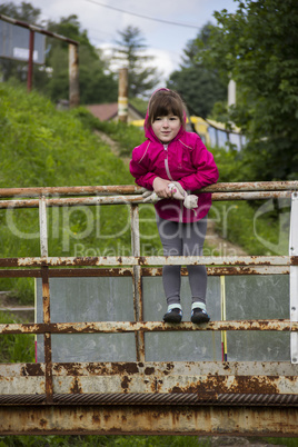 little girl at footbridge