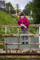 little girl at footbridge