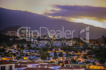 Small town in Tenerife under a volcano at the sunset