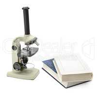 laboratory microscope and books isolated on white background