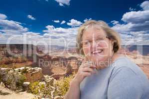 Happy Senior Woman Posing on Edge of The Grand Canyon