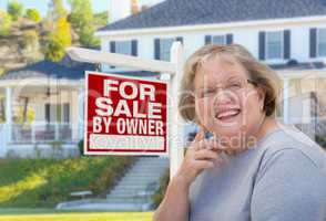 Senior Adult Woman in Front of Real Estate Sign, House