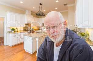 Happy Senior Man In Custom Kitchen Interior