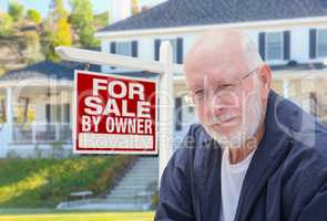 Senior Adult Man in Front of Real Estate Sign, House