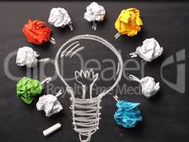 Crumpled paper with a hand drawn lightbulb