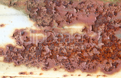 Rough surface of rusty iron with peeling paint