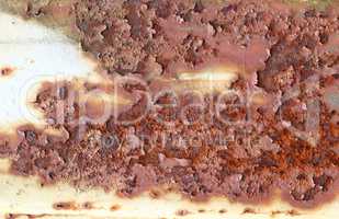 Rough surface of rusty iron with peeling paint