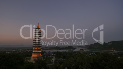 Bai Dinh Temple with illuminated tower in the dusk, Vietnam