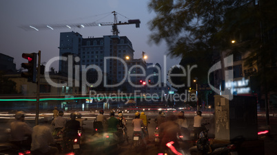 Transport on the roads of evening Hanoi, Vietnam