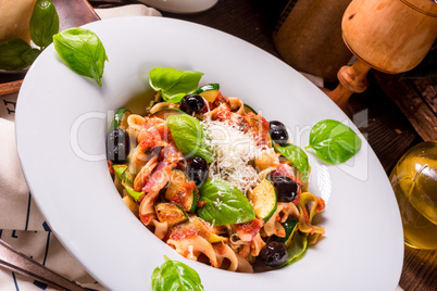 Ribbon Pasta with zucchini and olives in tomato sauce