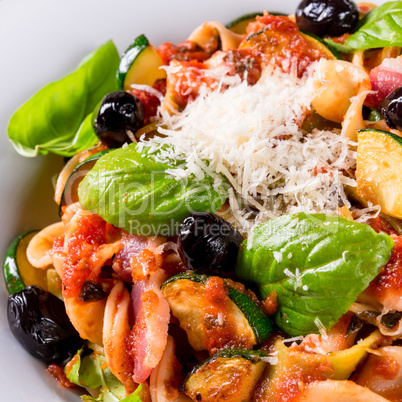 Ribbon Pasta with zucchini and olives in tomato sauce