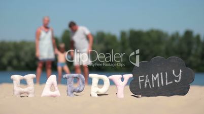 Blurred background of family playing on the beach