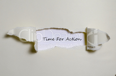 The word time for action appearing behind torn paper