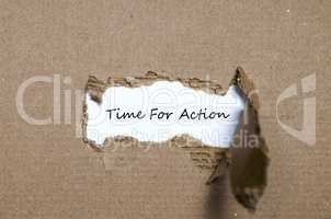 The word time for action appearing behind torn paper