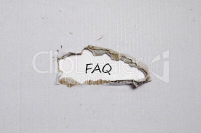 The word faq appearing behind torn paper