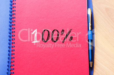 One hundred percent symbol on notebook