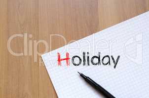 Holiday text concept on notebook