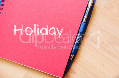 Holiday text concept on notebook