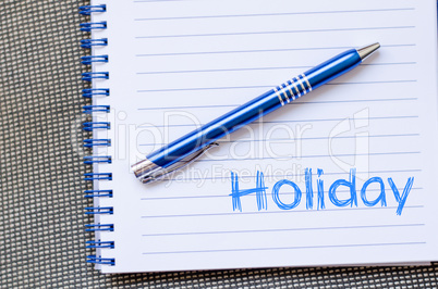 Holiday text concept on notebook