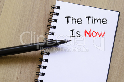 The time is now text concept on notebook