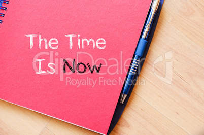 The time is now text concept on notebook