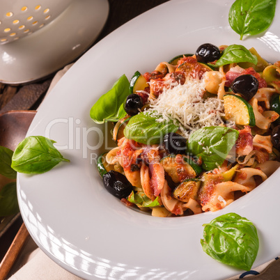 Ribbon Pasta with zucchini and olives in tomato sauce