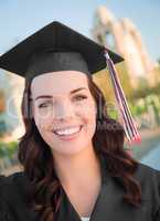 Happy Graduating Mixed Race Woman In Cap and Gown