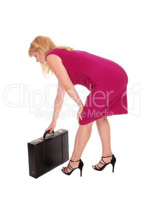 Woman bending getting brief case.