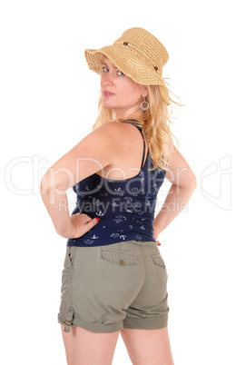 Woman in shorts and straw hat.