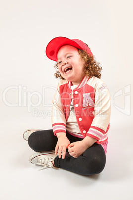 Little Girl Fashion Model With Red Cap