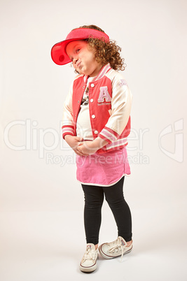 Little Girl Fashion Model With Red Cap