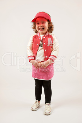 Little Girl Fashion Model With Red Cap