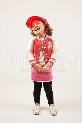 Little Girl Fashion Model With Red Cap