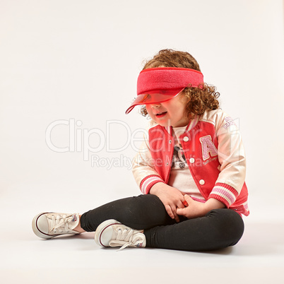 Little Girl Fashion Model With Red Cap