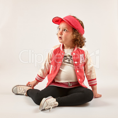 Little Girl Fashion Model With Red Cap