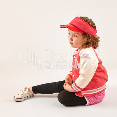 Little Girl Fashion Model With Red Cap