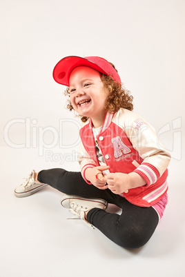 Little Girl Fashion Model With Red Cap