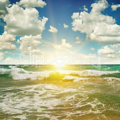 ocean, sandy beach, blue sky and sunrise