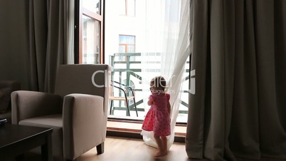 Child Playing Hide and Seek, Happy Little Girl Playing with Curtains, Children. Full HD. 1920x1080
