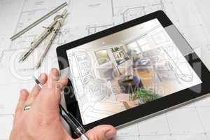 Hand of Architect on Computer Tablet Showing Living Room Over Ho
