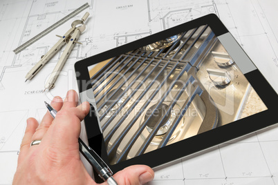 Hand of Architect on Computer Tablet Showing Stove Details Over
