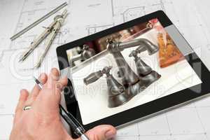 Hand of Architect on Computer Tablet Showing Bathroom Details Ov