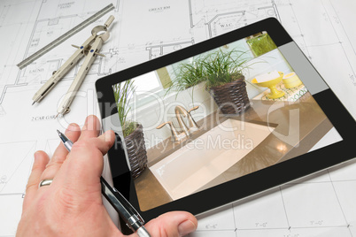 Hand of Architect on Computer Tablet Showing Bathroom Details Ov