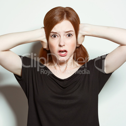 Emotional beauty portraits red-haired girl.