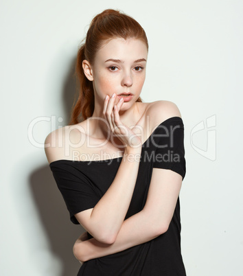 Emotional beauty portraits red-haired girl.