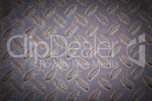 Old metal plate with raised pattern,