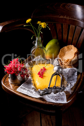 Homemade mango ice cream with currant